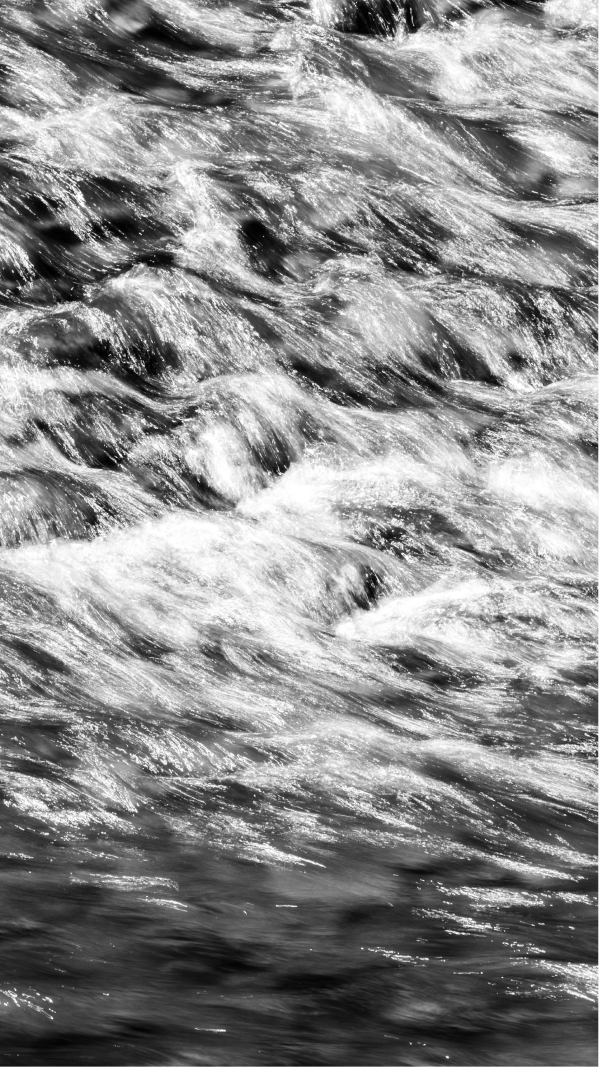 Blurry black and white image of a water stream